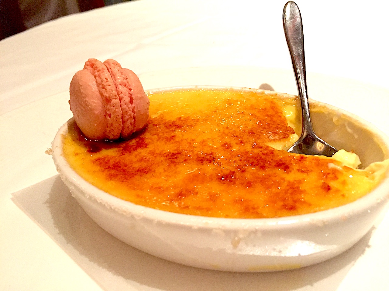 Creme Brulee at Lumiere's (Disney Magic) with a macaron on top - one of the best creme brûlées you'll ever have!