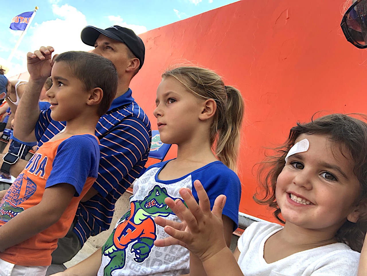 Family at UF Sports Event - 2-day itinerary for families in Gainesville, FL #gainesville #florida #tourofflorida #alachuacounty #gainesvilleFL #universityofflorida #UF #gogators #Gainesvillewithkids #gainesvilleitinerary
