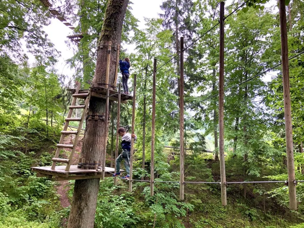 Sigulda Tarzan: Thrilling Family Day Trip Near Riga, Latvia | Adventure park in Latvia | Largest tree top obstacle course in the Baltics | Adventure park in the Baltics | Longest zip line in the Baltics | Zip lining Latvia | Riga road trips with kids | What to do in Riga with kids | #latvia #latviatravel #riga #baltictravel #adventurecourse #rigadaytrip #familytravel